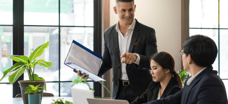 Team discussing pre-need sales in an office setting